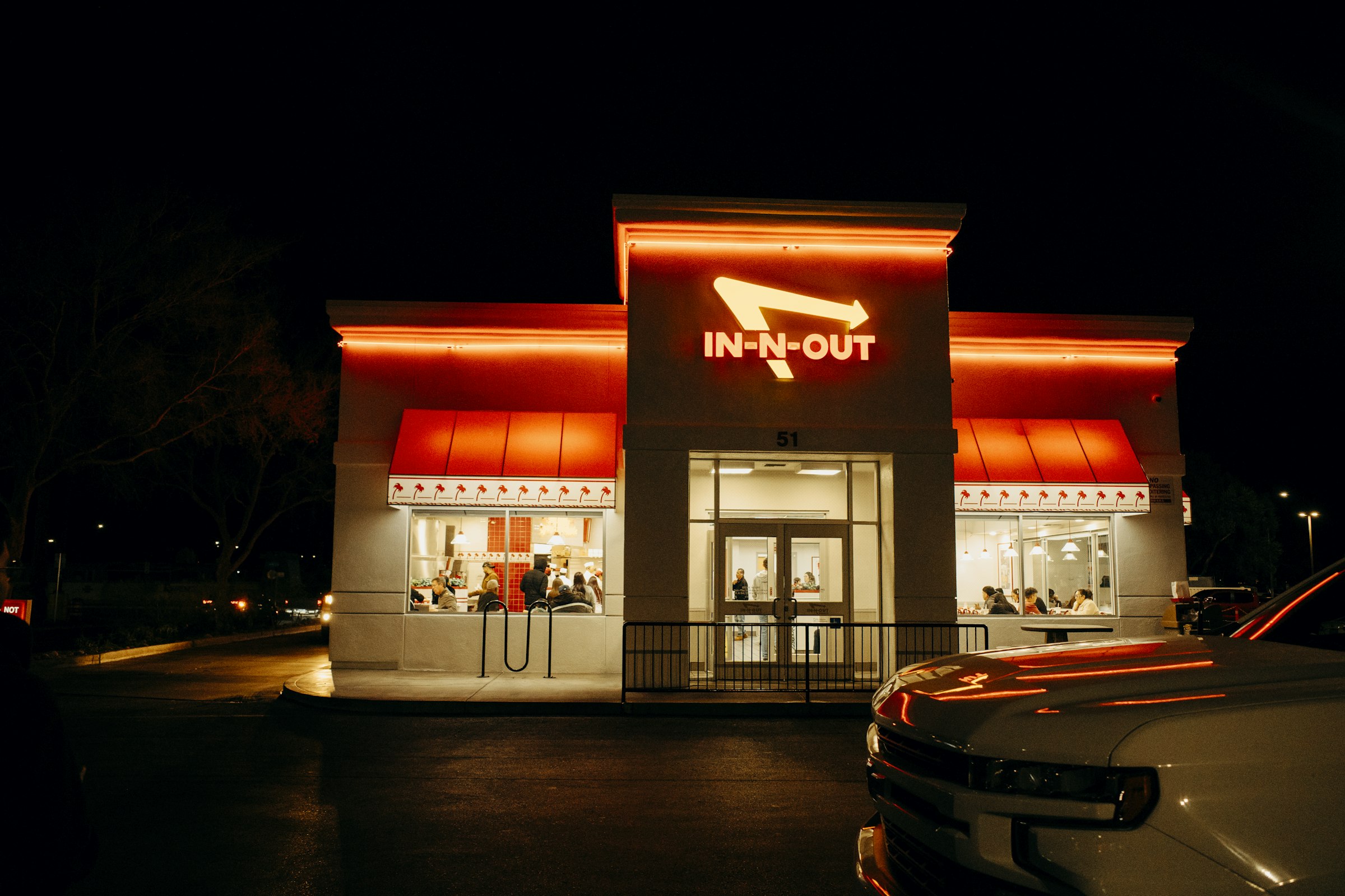 An In-N-Out Burger restaurant at night by Florian Schindler
